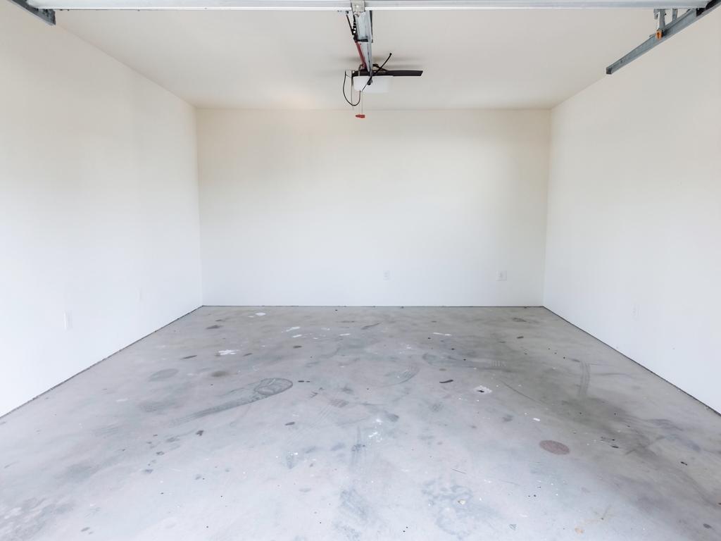 Empty swept garage after a Junk-In-The-Trunk cleanout